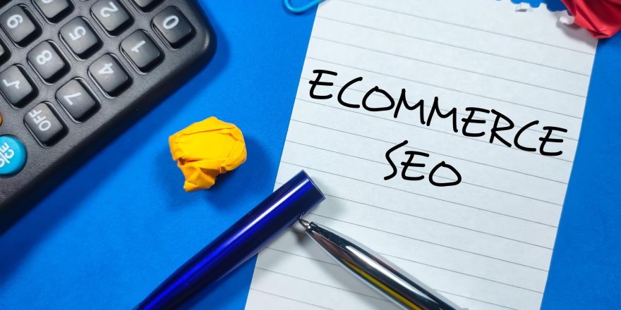 business-concepttext-ecommerce-seo-writing-notepaper-with-open-pentorn-paper-calculator