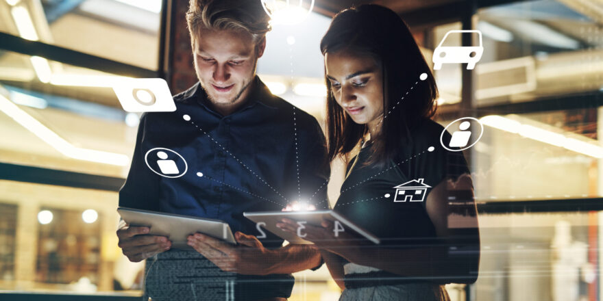 Business people, tablet and night with hologram in networking, research or global communication at office. Businessman and woman working late on technology in development or connectivity at workplace.