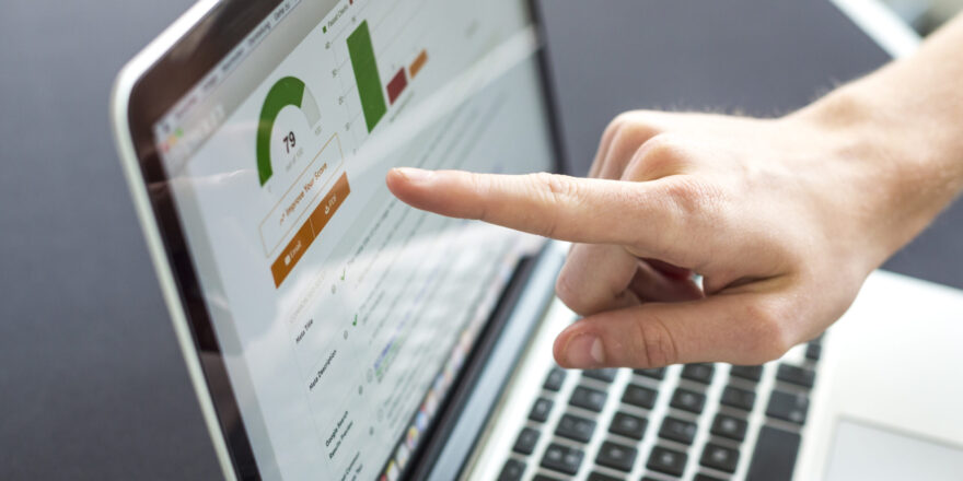 Accounting on a laptop, close-up of screen with hand
