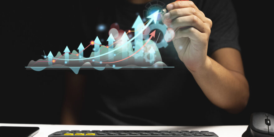 Hand of Businessman or trader showing a growing virtual hologram stock strategy