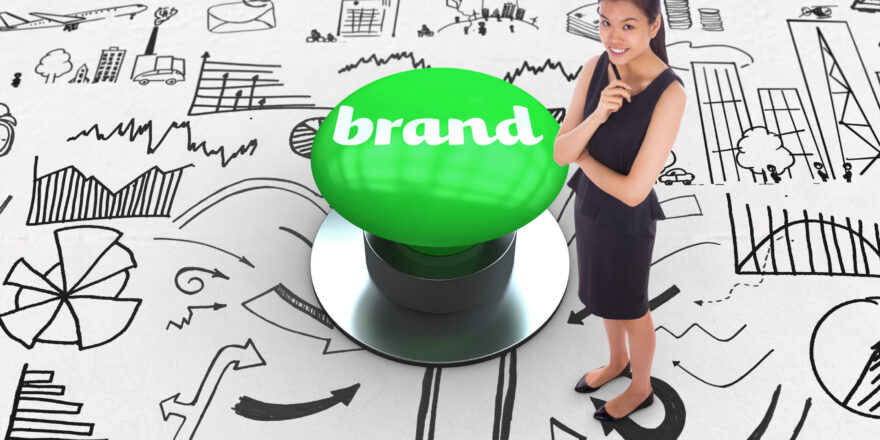 The word brand and thoughtful businesswoman against digitally generated green push button